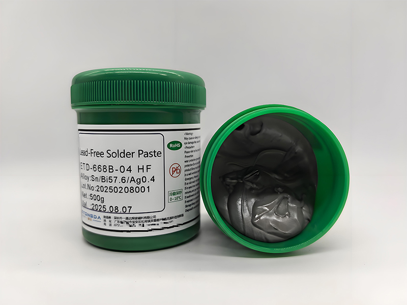 Microscopic view of soldering paste showing metal particles and flux components